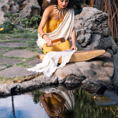 a person sitting on a rock