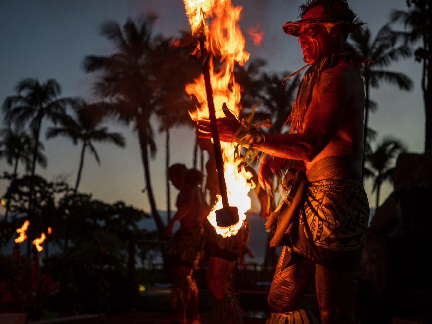a person standing in front of a fire