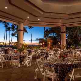 a group of people sitting at a table in a restaurant