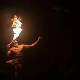 a person standing in front of a fire