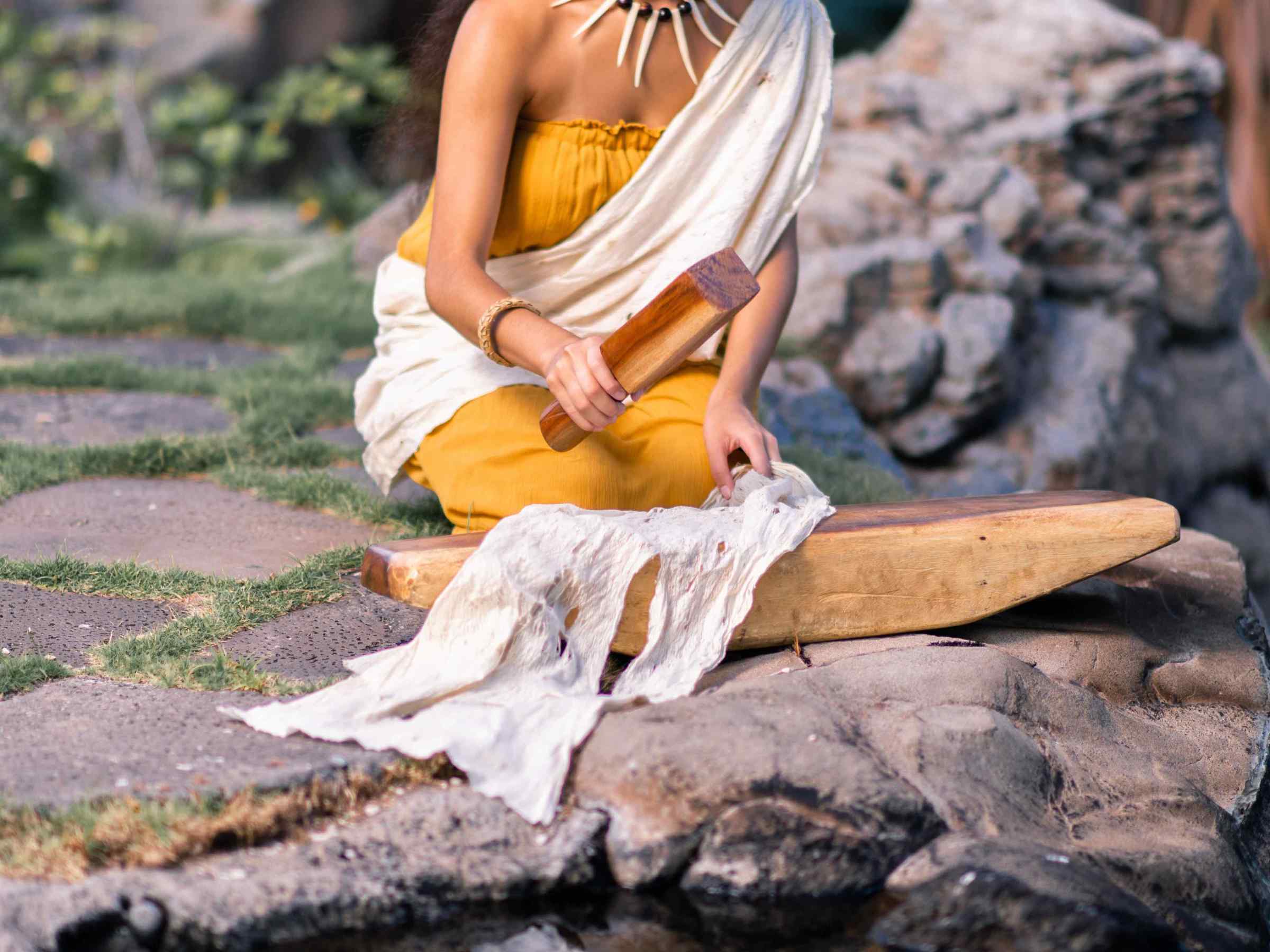 a person sitting on a rock
