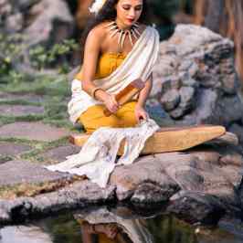 a person sitting on a rock